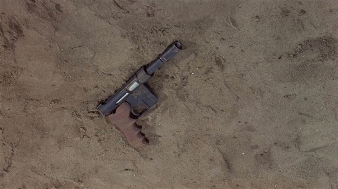 Matt's pistol falls to the ground during a fight at Dr. Wall's base.